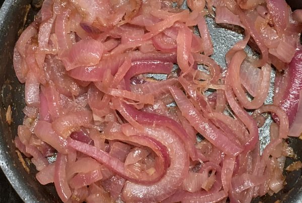 Red onions are sliced and then cooked, in a frying pan with sugar and white vinegar added to get the bitter sweet result when the onions sweat down and caramelised and go sticky, They are lovely served with Barbecued meat or as a filling in mushrooms or tarts