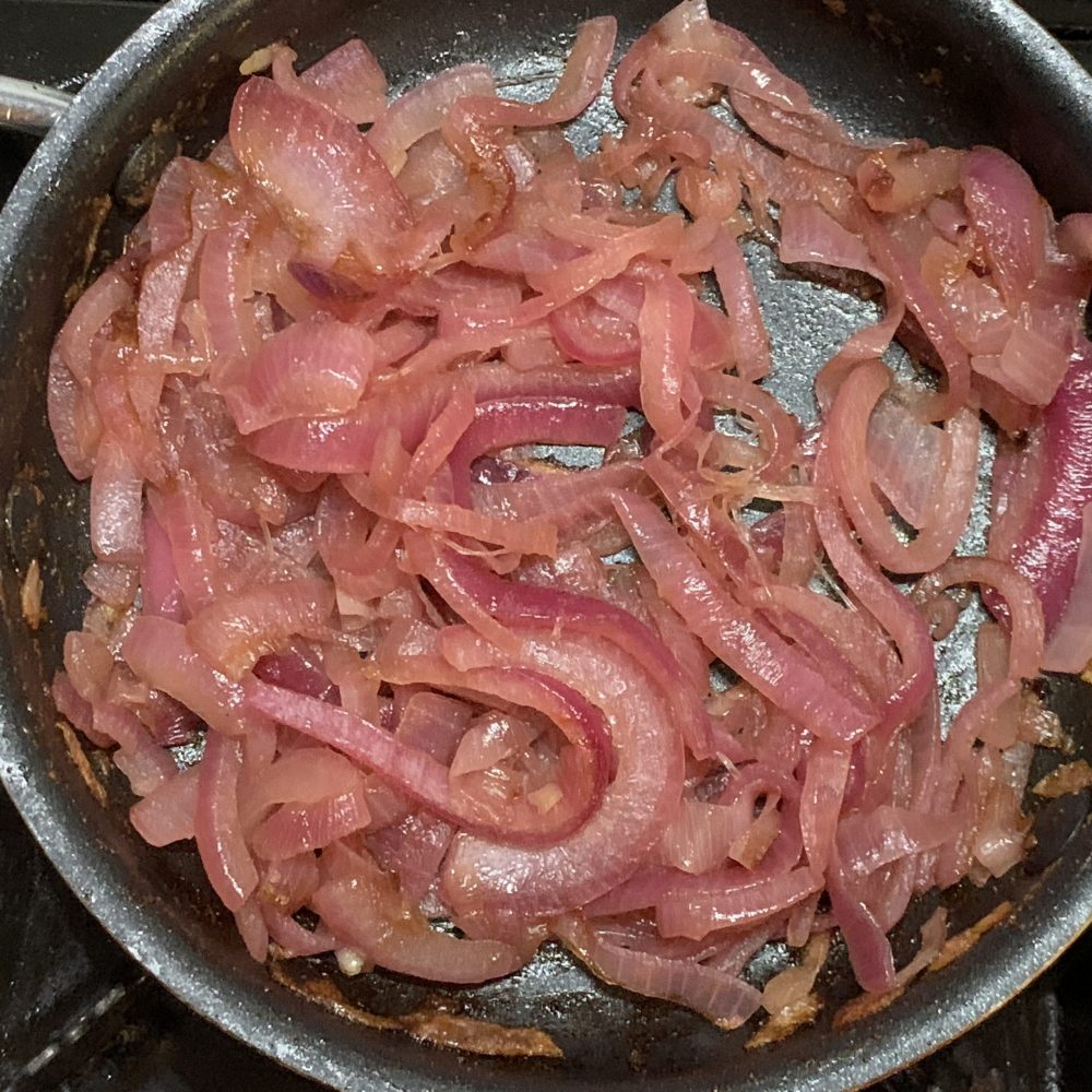 Red onions are sliced and then cooked, in a frying pan with sugar and white vinegar added to get the bitter sweet result when the onions sweat down and caramelised and go sticky, They are lovely served with Barbecued meat or as a filling in mushrooms or tarts