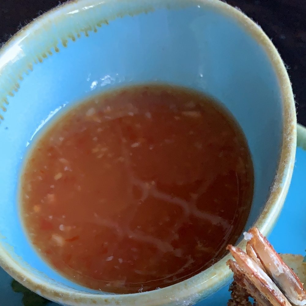 Sweet and Spicy "Thai Sweet Cilli Sauce" served in a small blue bowl