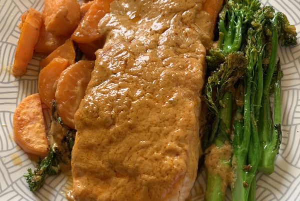 A lovely red curry coconut sauce poured over a perfectly cooked fillet of salmon with charred sweet potato and broccolini for one.